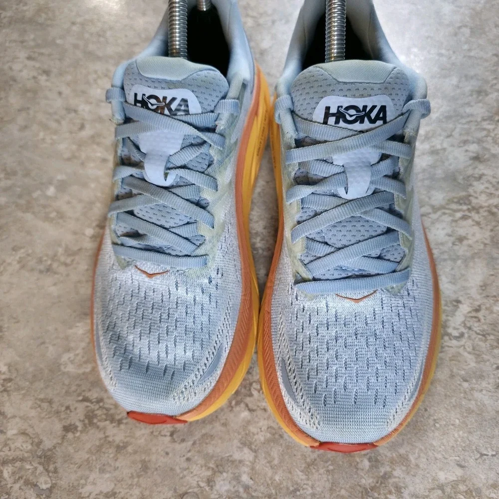 Hoka One One Women's Light Blue Running Shoes with Yellow and Orange Midsole